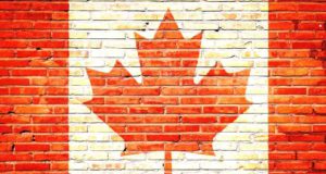 Ohne eTA keine Einreise in Kanada! Kanada: Mauer mit aufgemalter kanadischer Fahne