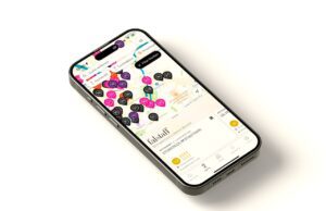 Falstaff-App für Speisen, Reisen und Genuss Falstaff-App: Mobiltelefon mit einer Karte, auf der viele bunte Punkte die empfohlenen Lokal und Hotels markieren