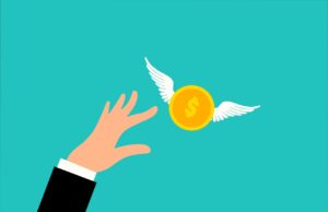 Wofür Geschäftsreisende Geld ausgeben Wofür Geschäftsreisende unterwegs Geld ausgeben: Illustration zeigt eine Hand, die nach einer gelben Münze mit weißen Flügel greift