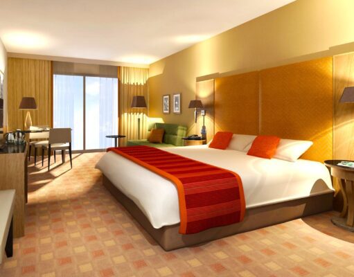 ehotel Top-Mittelstandsdienstleister in 2026 ehotel als bester Mittelstandsdienstgleiter in der Kategorie Hotelportl: Hotelzimmer mit roter Decke auf dem Bett mit angenehmer Beleuchtung