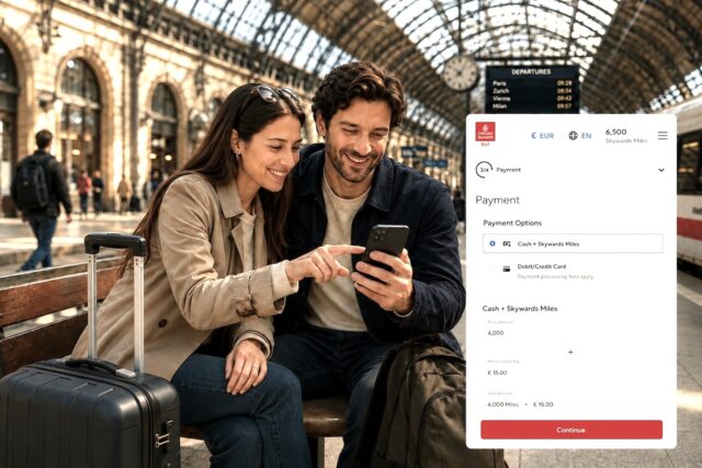 Emirates Skywards Railway Emirates Skywards: Ein Mann und eine Frau blicken auf ihr Handy, daneben Display mit Skywards Rail Buchungsplatt6form